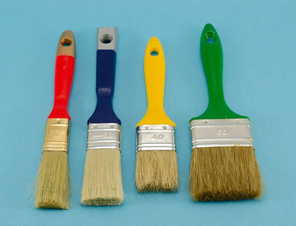 Paint brush color size on blue — Stock Photo, Image