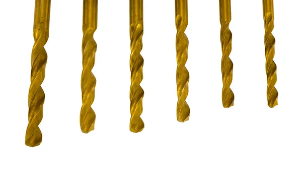 Various size golden drill bits isolated on white — Stock Photo, Image