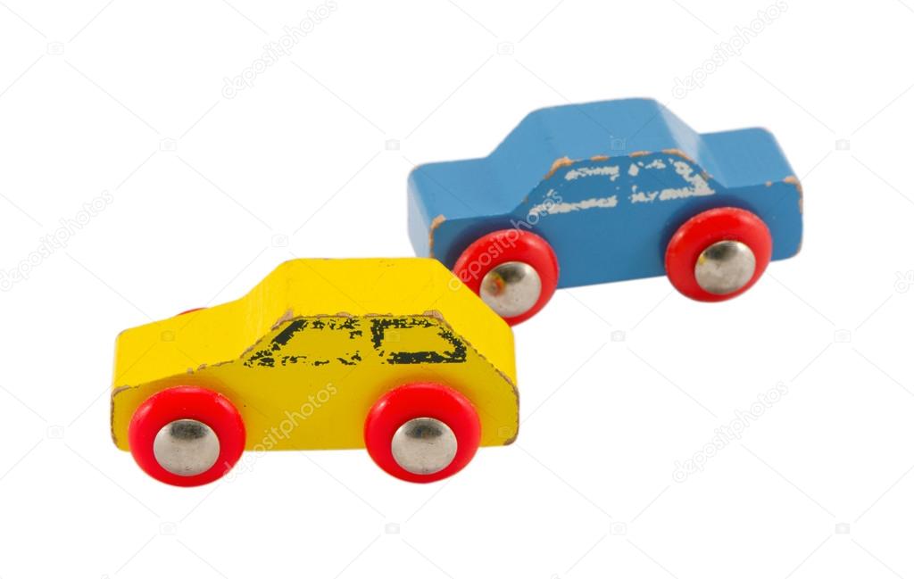 Pair wooden blue yellow retro toy cars isolated