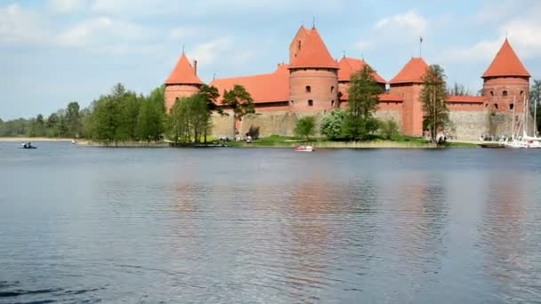 Trakai castle kid in zorb water bubble on galve lake — Stock Video
