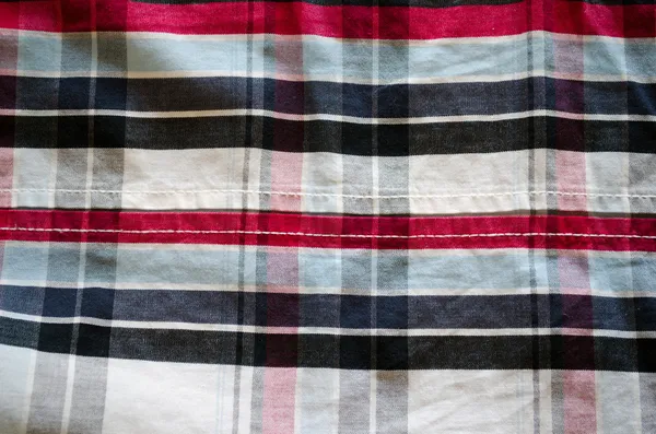 Tela algodón cuadrado rojo azul negro fondo — Foto de Stock