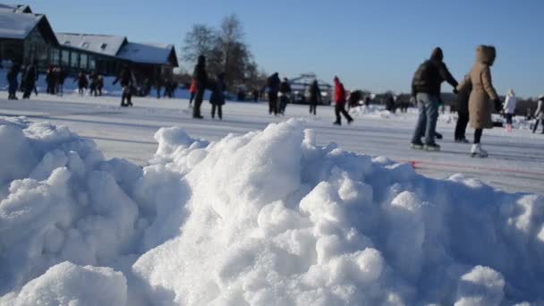 Pile snow closeup active sport leisure skating rink — Stock Video