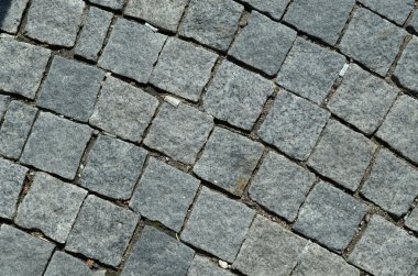 Grunge Arnavut kaldırımlı yol arka plan sigara izmaritleri