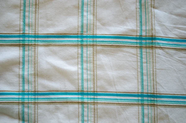 Closeup crumple shirt fabric green square shape texture background — Stock Photo, Image