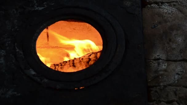 Fire burn round hole rural stove furnace rusty steel plate — Stock Video