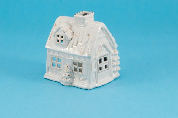 White ceramic toy house decoration blue background — Stock Photo, Image