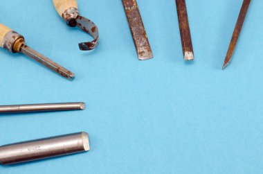 chisel graver carve tools set on blue clipart