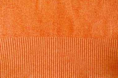 Fondo de primer plano de suéter de lana de punto naranja