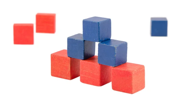 Pyramid made wood color toy bricks blocks isolated — Stock Photo, Image