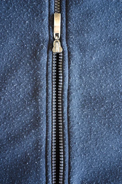 Mikiny šaty vertikální zip tkaniny pozadí — Stock fotografie