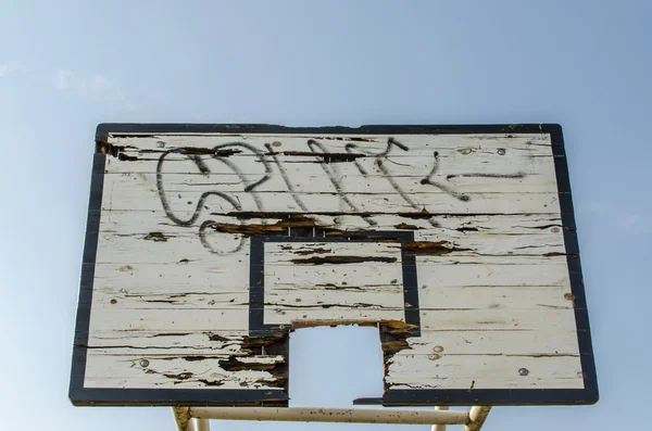 Wooden broken basketball board blue sky background — Stock Photo, Image