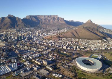 Cape Town, South Africa - 19 April 2022: Aerial view over Cape Town, with Cape Town stadium and Table Mountain . clipart