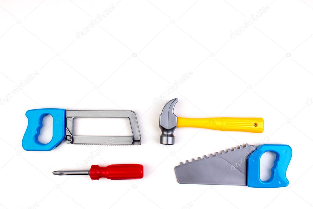 Toy. professional repairing implements for decorating and building renovation set on the on white background. Electrical tools. Top view. Copy space for text