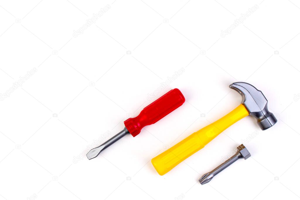 Toy. professional repairing implements for decorating and building renovation set on the on white background. Electrical tools. Top view. Copy space for text