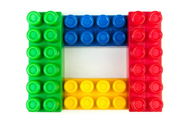 Lot of colorful rainbow toy bricks background. Educational toy, constructor for children Isolated on white background. 3D Rendering. Top view with copy space