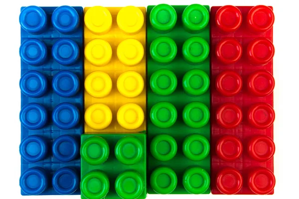 Lot of colorful rainbow toy bricks background. Educational toy, constructor for children Isolated on white background. 3D Rendering. Top view with copy space