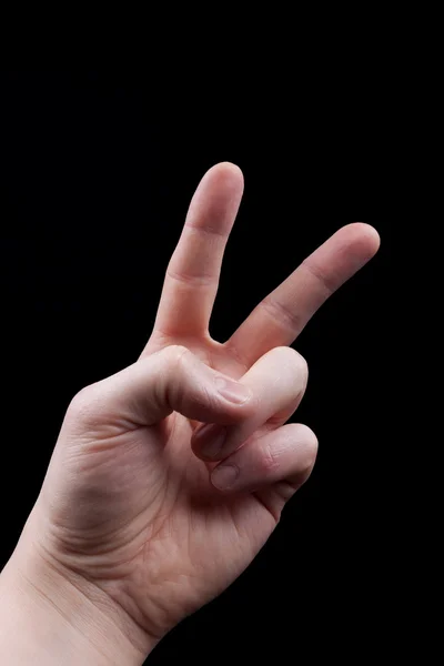 Hand with peace sign on black background — Stock Photo, Image