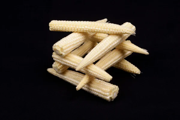 Baby corn on black background — Stock Photo, Image