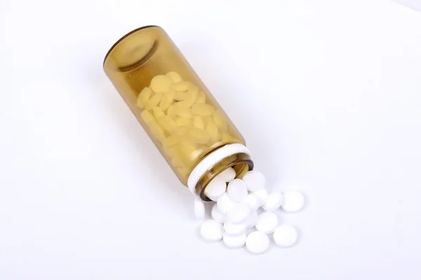 Suplements pills on the table with dose — Stock Photo, Image