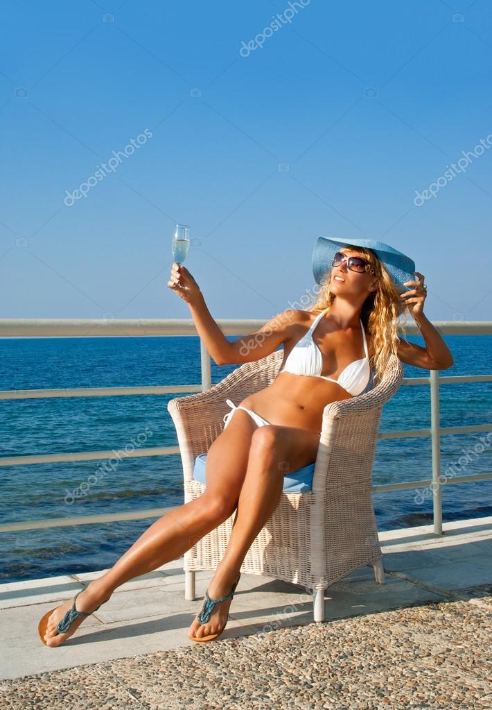 Sexy woman relaxing on Mediterranean coast in sunny day ...