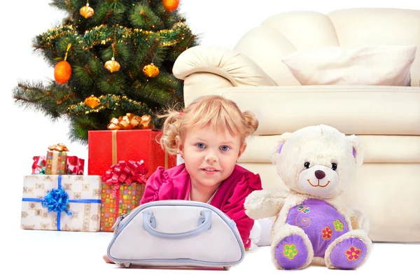 Happy smiling little girl with gifts — Stock Photo, Image