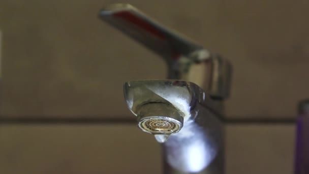 Water dripping from the tap close-up — Stockvideo