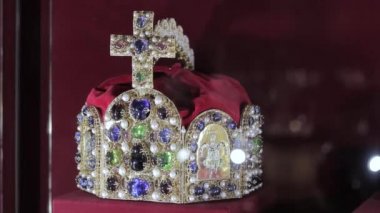 Beautiful jewel crown with ruby and diamond stones on velvet with color and blur effects/Jewelry crown/decoration item