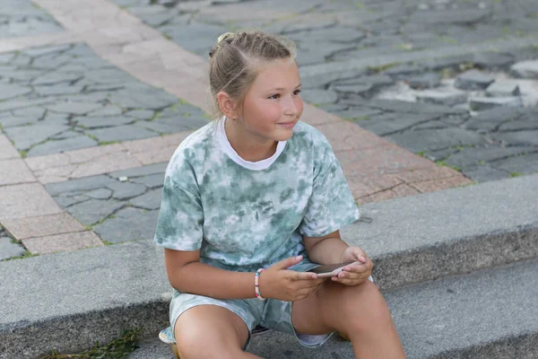 Happy Cute Teenage Girl Sits Skateboard Steps City Smartphone Her — Stock Photo, Image