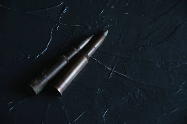 Ammunition close up on a black background. The concept of modern armaments, the war in Ukraine and the defense of the state. — Zdjęcie stockowe