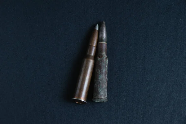 Ammunition close up on black background, copy space. The concept of modern armaments, the war in Ukraine and the defense of the state. — Zdjęcie stockowe