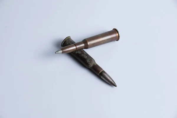 Cartridges with shell casings close up on a white background with space for text — 스톡 사진