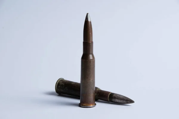 Cartridges with shell casings close up on a white background with space for text — Stock Photo, Image