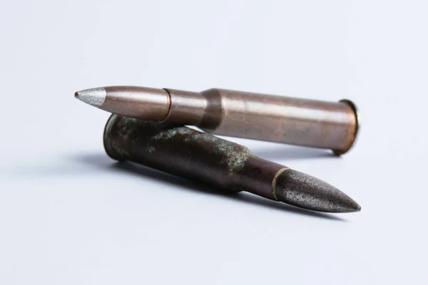 Cartridges with shell casings close up on a white background with space for text — Zdjęcie stockowe