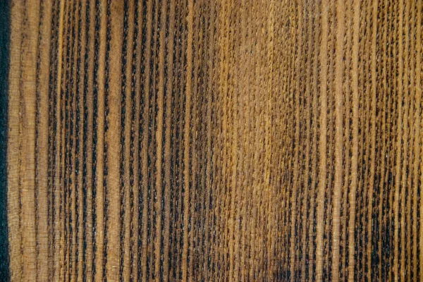 Tasarım işleri ve ev dekorasyonu için eski koyu renkli bir tahtanın ahşap dokusu..