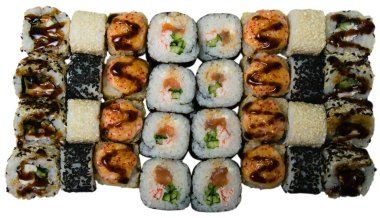 Sushi set on a white background, isolate, top view. Sushi rolls with lightly salted salmon, cheese, sesame and chicken covered with sauce.
