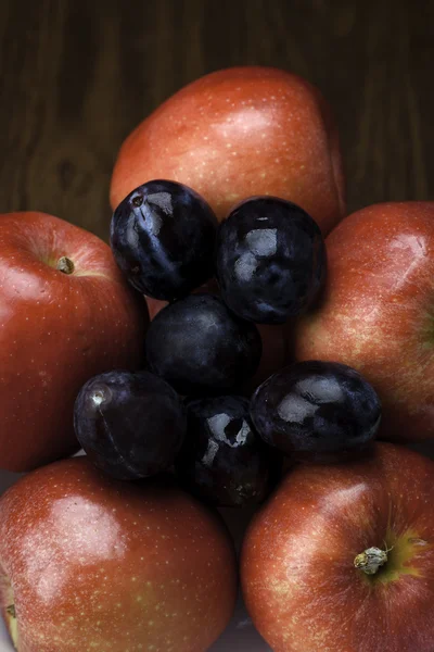 Close up of apples and plums. — Stock Photo, Image