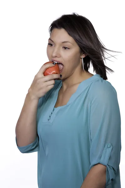 Woman takes a bite. — Stock Photo, Image