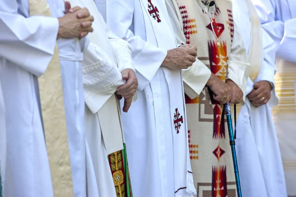 Priests with folded hands. — Stock Photo, Image