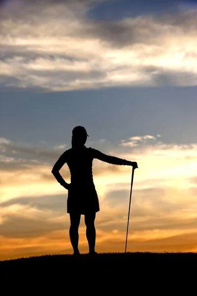 Silhouetted golfer enjoys view. — Stock Photo, Image