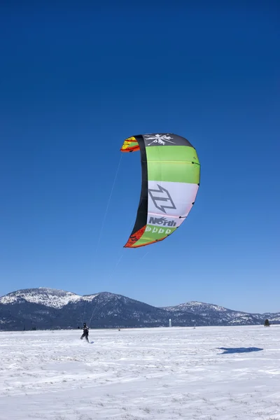 Large kite pulling boarder. — Stock Photo, Image