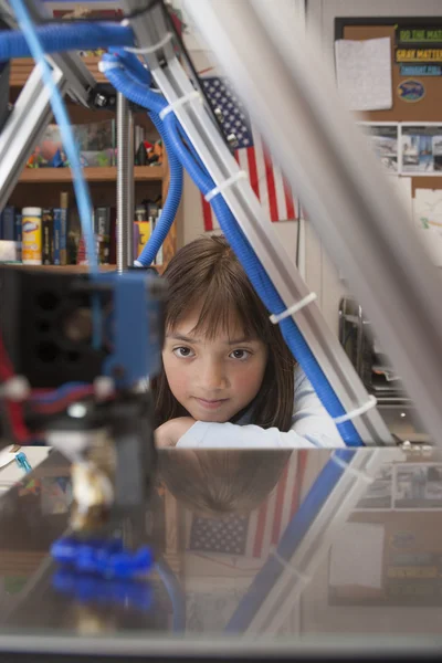 Girl watches 3D printer. — Stock Photo, Image