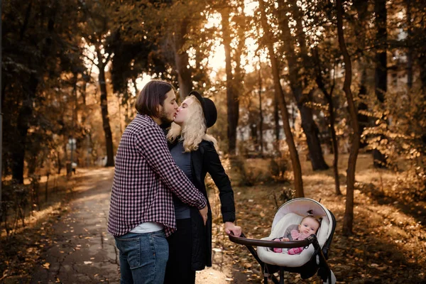 Young Family Walking Autumn Park Baby Stroller Father Mother Looking — Foto Stock