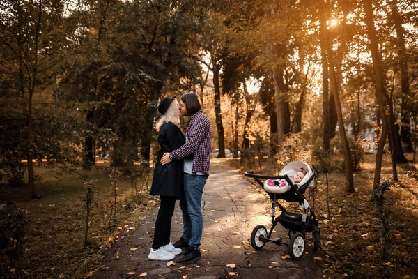 Young Family Walking Autumn Park Baby Stroller Father Mother Looking — Stock Photo, Image