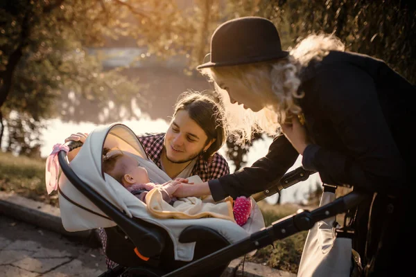 Young Happy Family Walking Baby Stroller Autumn Park Laughing Having — Zdjęcie stockowe