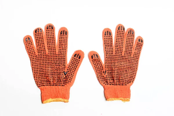 Turuncu işçi eldivenleri beyaz arka planda izole edilmiş.