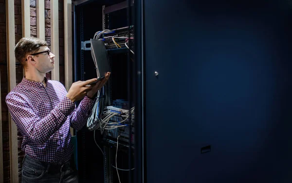 Server Room Technician Engineer Glasses Hold Notebook Adjust Internet Connecting — 图库照片