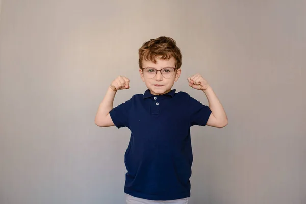 Happy Little Boy Kid Blue Shirt Wearing Glasses Showing Strong — Stock Fotó