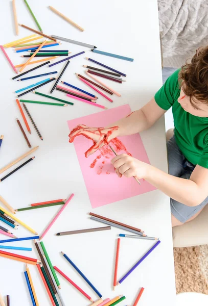 Close Boy Kid How Painting His Hand Red Paint Background — Stock Photo, Image