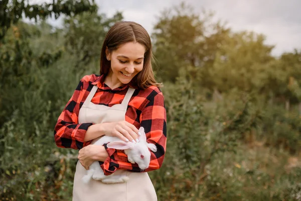 Young Happy Smiling Woman Farmer Holding White Rabbit Her Hands — Fotografia de Stock