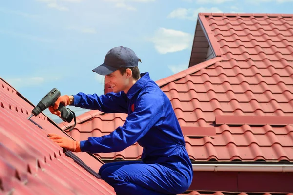 Close Young Happy Man Contractor Worker Blue Overalls Repairing Red — Stock Fotó